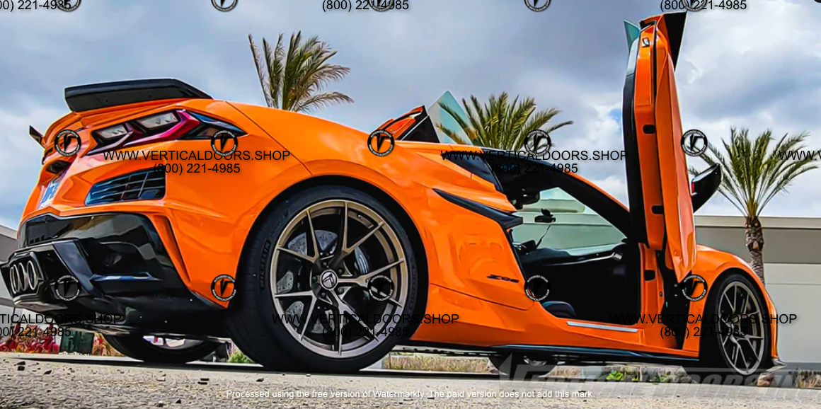 Orange C8 Z06 sports car equipped with C8 Z06 vertical door kit by Vertical Doors Inc in an outdoor setting