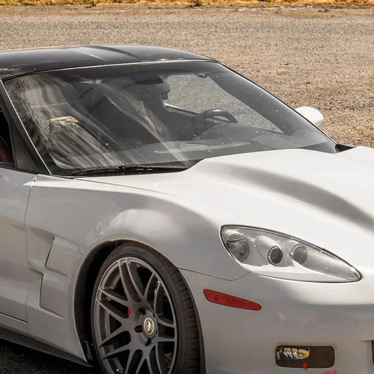 California Super Coupes Corvette C6 wide body fenders on white Corvette front side view