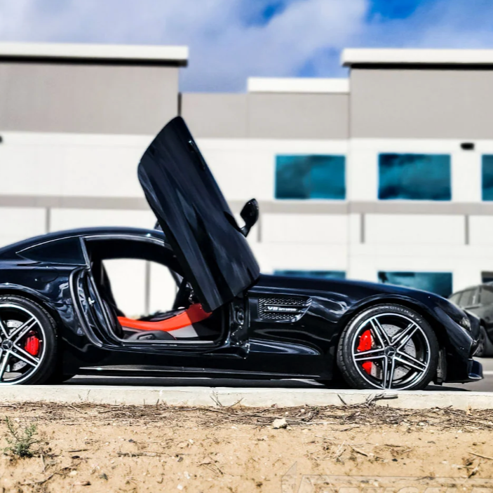 Black Mercedes AMG GT with open lambo doors and red interior showing Mercedes AMG GT lambo doors kit