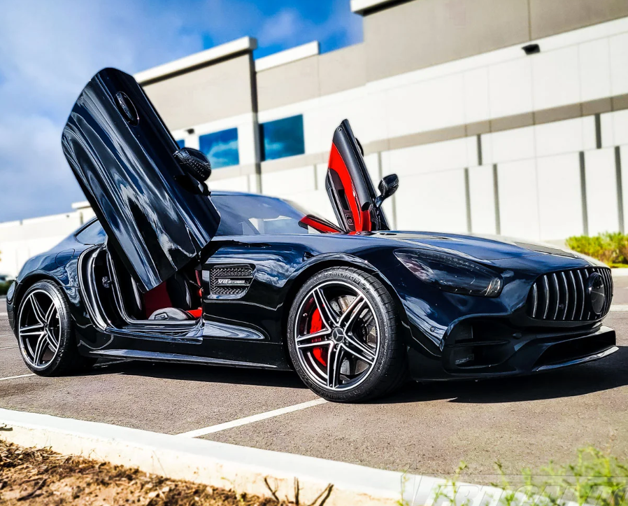 Black Mercedes AMG GT with Vertical Doors Inc Mercedes AMG GT lambo doors kit installed open in parking lot