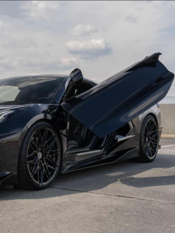 Black C8 Corvette with open butterfly doors featuring C8 Corvette butterfly door kit by Vertical Doors Inc