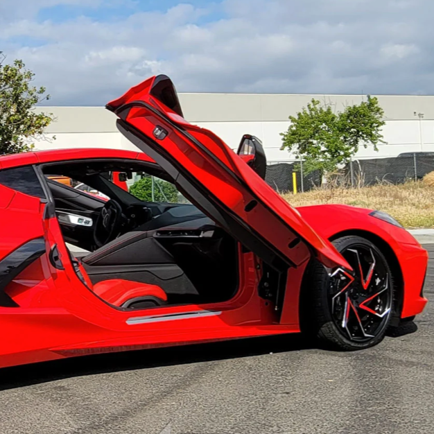 Red C8 Corvette with open butterfly door equipped with C8 Corvette butterfly door kit by Vertical Doors Inc