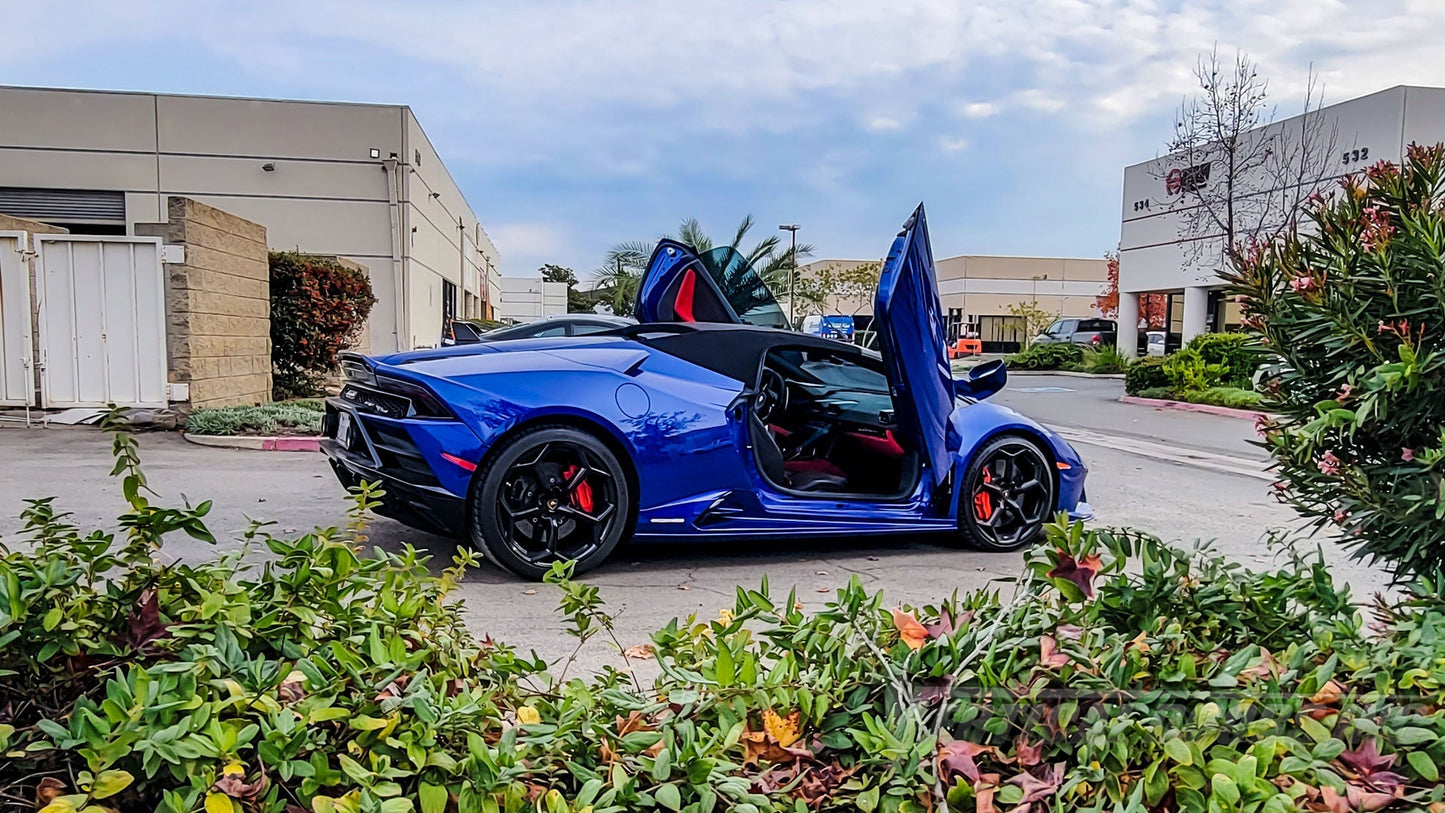 Blue Lamborghini Huracan with Lambo door kit for Lamborghini Huracan installed by Vertical Doors Inc