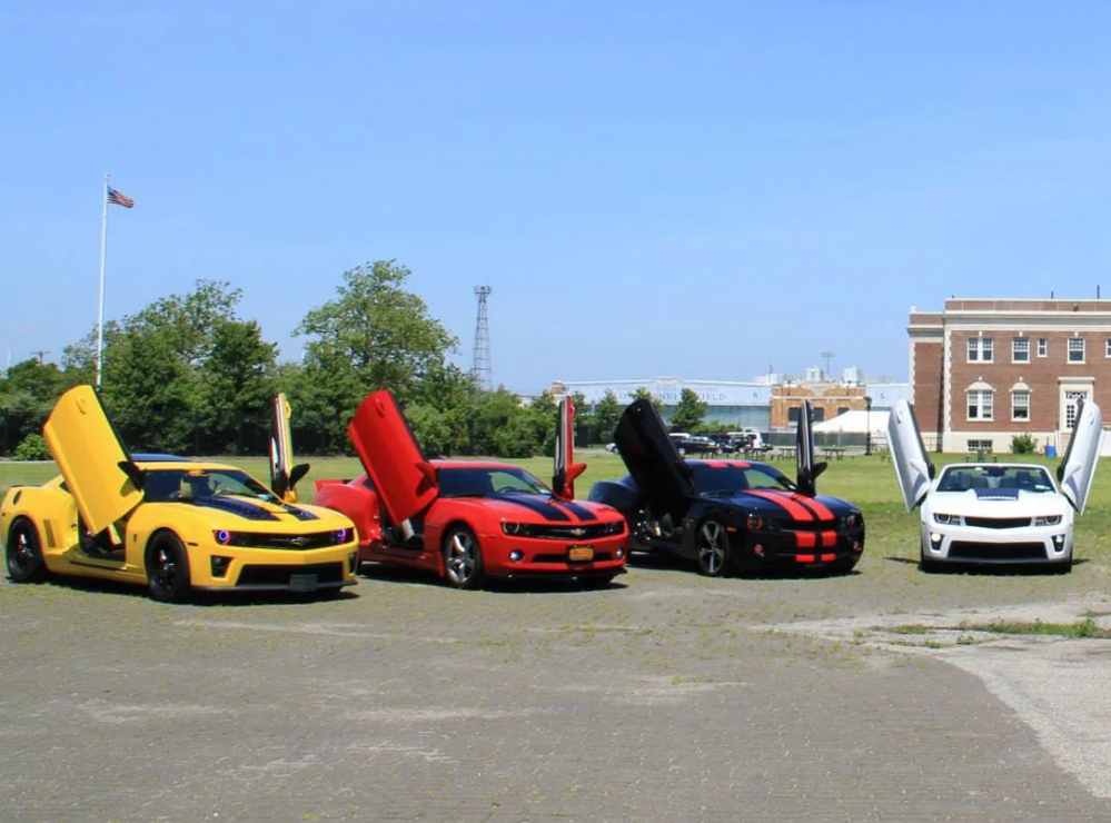 Yellow red black and white Camaro cars with Camaro vertical doors kit installed on all vehicles