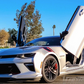 White Chevrolet Camaro with Chevrolet Camaro vertical door kit installed and doors open upward
