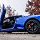 Blue Lamborghini Huracan with Vertical Doors Inc Lambo door kit for Lamborghini Huracan fully opened on a street