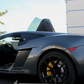 Gray sports car with Gallardo Lambo doors kit open showing vertical door style by Vertical Doors Inc