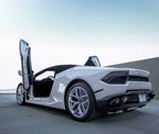 White Lamborghini Huracan with Huracan Lambo door kit open showing vertical doors on sports car