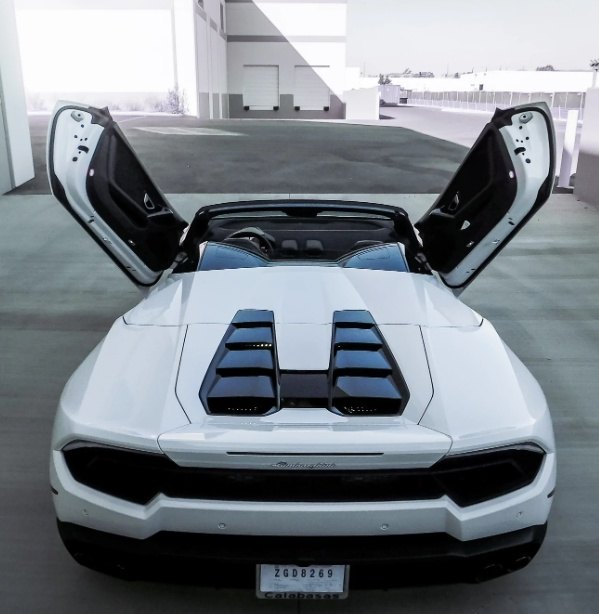 White Lamborghini with Huracan Lambo door kit open showing vertical doors on both sides